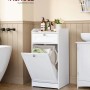 Weißer Songmics Badezimmerschrank mit Wäschesammler und Schublade im Badezimmer.