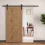 HOMCOM Schiebetür-Beschlagsatz aus Kohlenstoffstahl, schwarz, mit Holz-Schiebetür im Raum.