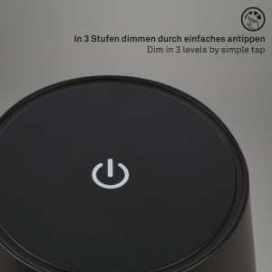 Detailaufnahme: Schwarze Brilo Akku-Tischleuchte mit Touchdimmer und Power Symbol.