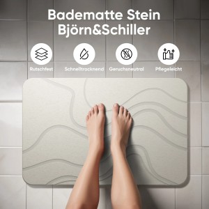 Weiße Björn&Schiller Badematte aus Kieselgur, 60x39 cm, mit Füßen auf Fliesenboden. Steinmatte für Badezimmer.