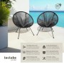 Zwei schwarze Tectake Gartenstühle Santana im Acapulco Retrodesign mit Schnurbespannung auf Terrasse am Meer.