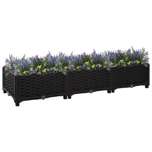 Schwarzes furnicato Hochbeet (120x40x23 cm) aus Polypropylen, bepflanzt mit Blumen.