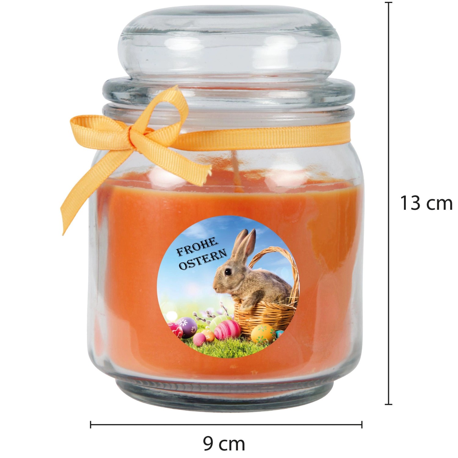 Orangefarbene Duftkerze im Glas mit Osterhase und Korb Motiv, ideal als Osterdeko.