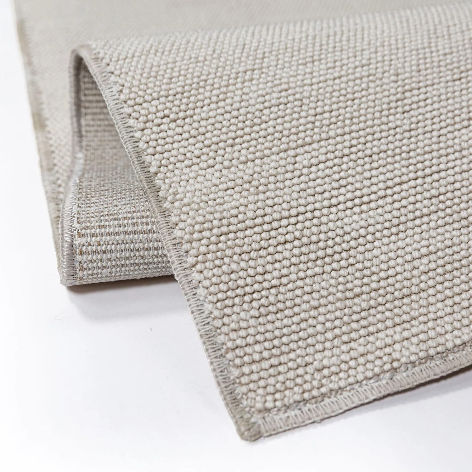 Flair Rugs Kurzflorteppich Grau, waschbar. Zeigt feine Boucle-Struktur des Polyester-Teppichs.