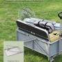 Zusammengeklappter, schwarzer WOLTU Campingtisch mit Griff im Bollerwagen. Kompakter Klapptisch für Camping & Outdoor.
