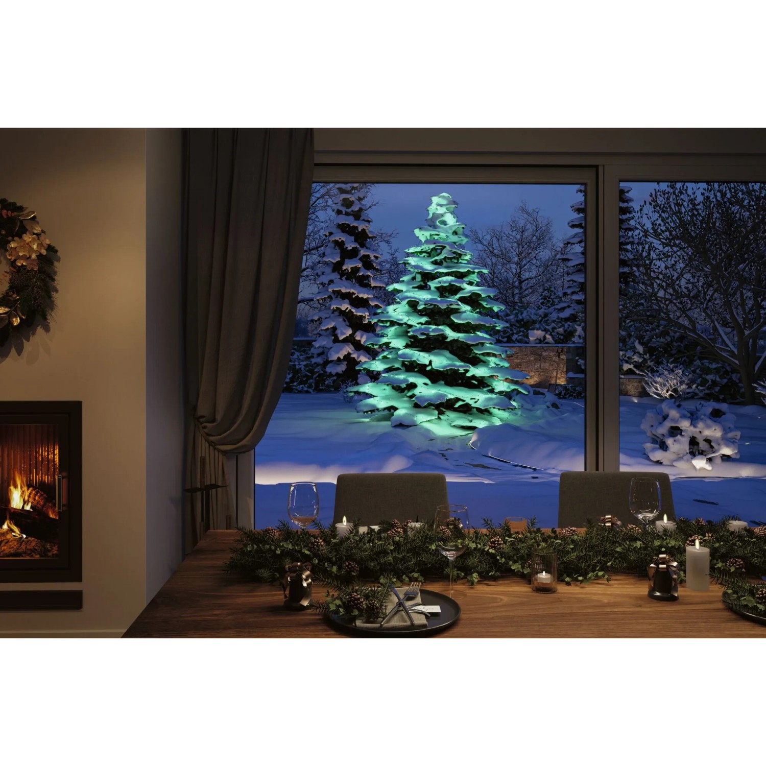 Paulmann Plug & Shine LED-Lichterkette Yuna RGB beleuchtet grünen Baum im Schnee. Dekorative Außenbeleuchtung.