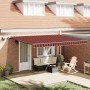 Ausgezogene, orange-braune vidaXL Markise (450x300 cm) spendet Schatten auf Terrasse mit Möbeln.