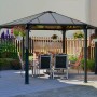 Anthrazitfarbener Palram Canopia Monaco Gartenpavillon 4.5 x 3.9 m mit LED-Set und Tischgruppe.