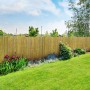 Bambus Sichtschutzzaun Brasil im Garten, hellbraune Bambusrohre als Zaun.