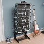 Juskys 5in1 Multi-Spieltisch Ballzauber als Tischkicker mit Gitarre und Schuhen im Hintergrund.