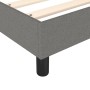 Detailansicht Boxspringbett in Dunkelgrau mit Stoffbezug und schwarzen Füßen.