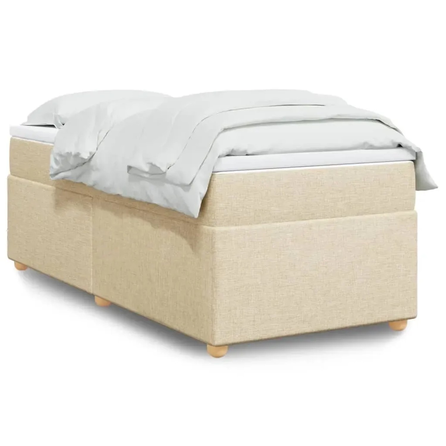 Cremefarbenes Boxspringbett 90x190 cm mit Matratze und weißer Bettwäsche.