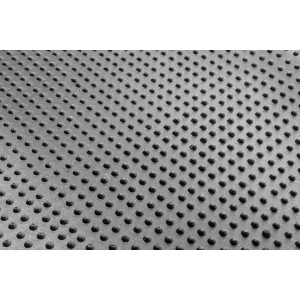 Detailansicht der Oberfläche einer grauen Jet-Line Stufenmatte aus Gummi mit Noppen.