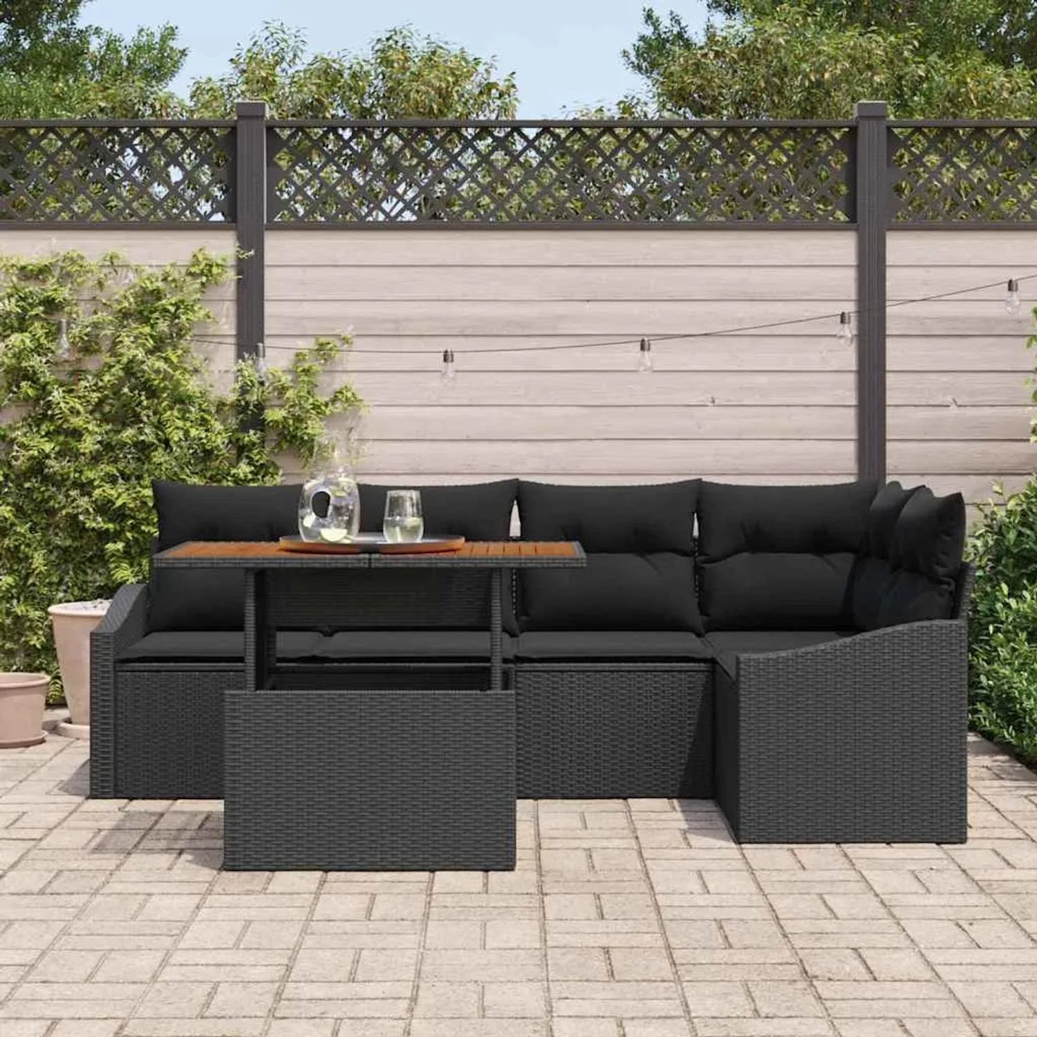 Schwarzes 6-tlg. vidaXL Garten-Sofa-Set aus Poly Rattan mit Tisch und Stauraum.