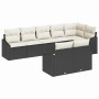 Schwarzes 8-teiliges Garten-Sofa-Set aus Poly Rattan mit cremefarbenen Kissen.