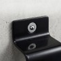 Schwarzer Relaxdays Stahl Wand- und Bodenanker mit silberner Schraube an Betonwand. Diebstahlsicherung für Fahrräder.