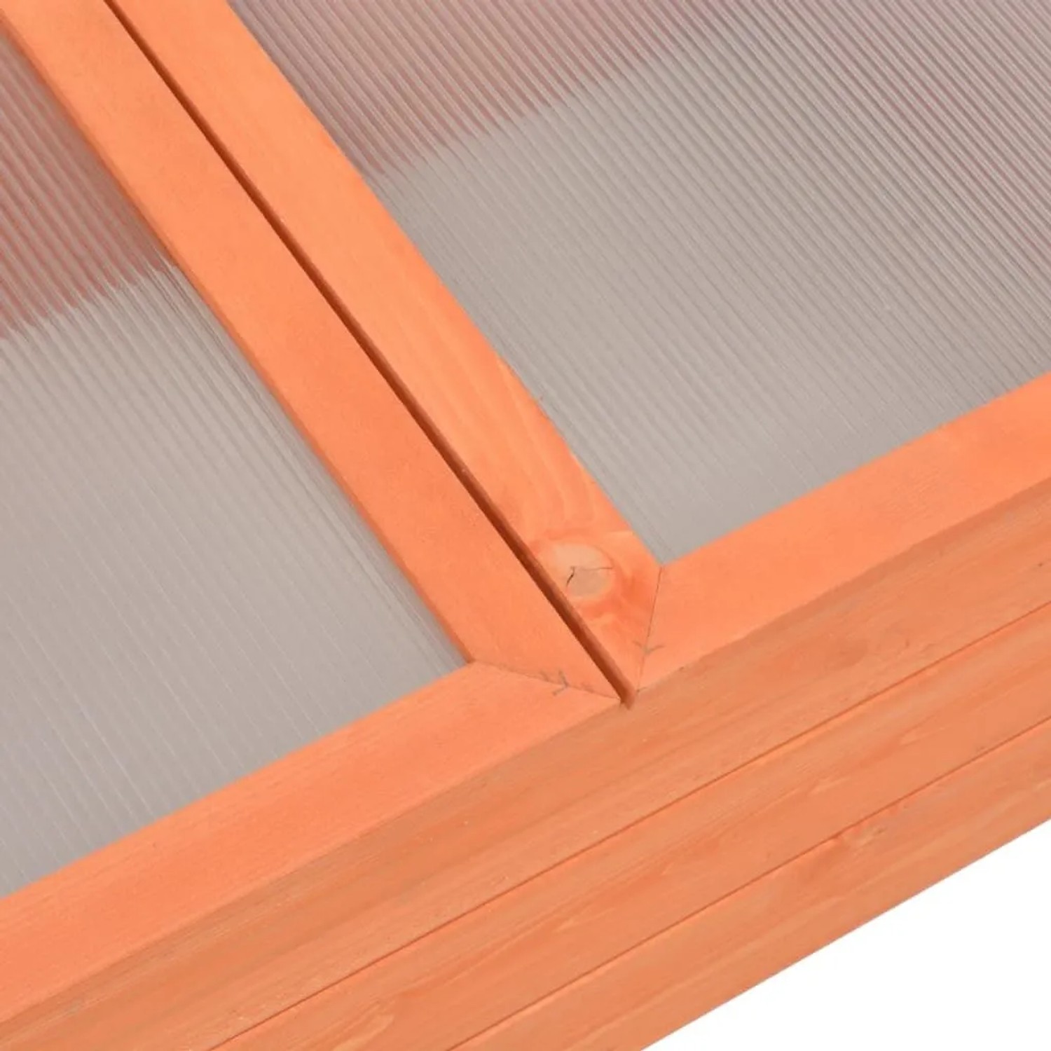 Detailansicht des vidaXL Frühbeet aus Holz und PC-Platte. Zeigt die helle Holzmaserung und die gerippte, transparente Abdeckung.