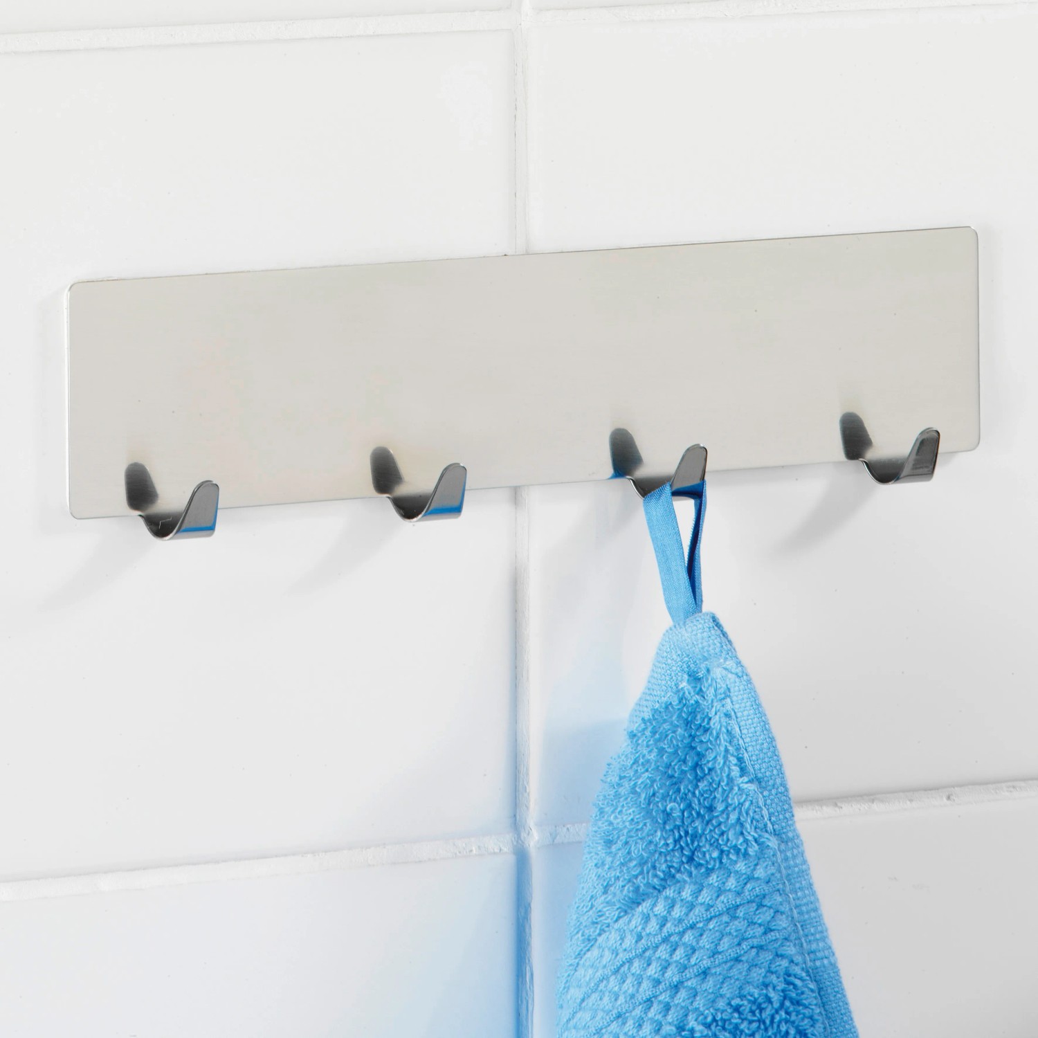 Wenko Hakenleiste Esperia mit 4 Haken, glänzend, selbstklebend, aus Edelstahl.