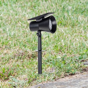 Schwarze PRIOS LED Solarleuchte Birko mit Erdspieß im Garten.