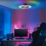Schwarze LED-Deckenleuchte Palmero mit Ventilator und RGB-Rahmenlicht im Gaming-Zimmer.