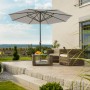 Schneider Marktschirm, Ø 320 cm, silbergrau, mit Kurbel, auf Terrasse mit Gartenmöbeln.