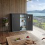 Dunkelgrauer Biohort Terrassenschrank Romeo Gr. M mit geöffneter Tür auf einer Terrasse.