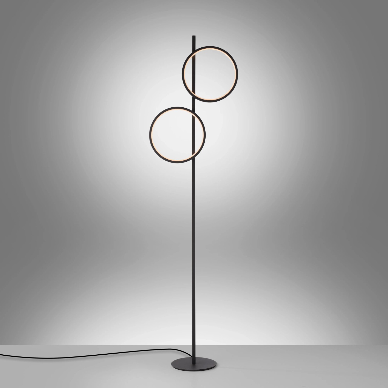 Schwarze Just Light Stehleuchte Mini Ritus mit zwei runden LED-Leuchtelementen.