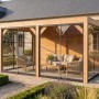 Moderne weka Gartenlaube Lumley aus Fichte mit Glas-Schiebetüren und Flachdach, als Terrassenüberdachung im Garten.