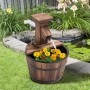 Outsunny Gartenbrunnen aus Tannenholz und Metall im Natur-Look, mit Blumen bepflanzt.
