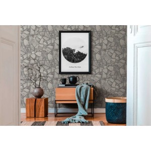 A.S. Création Vliestapete in Grau mit Bruchsteinmauer-Design im Raum.