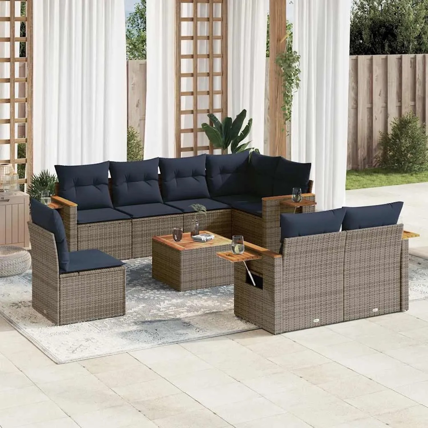 Graue 9-tlg. vidaXL Garten-Sofagarnitur aus Polyrattan mit marineblauen Kissen und Akazientisch.