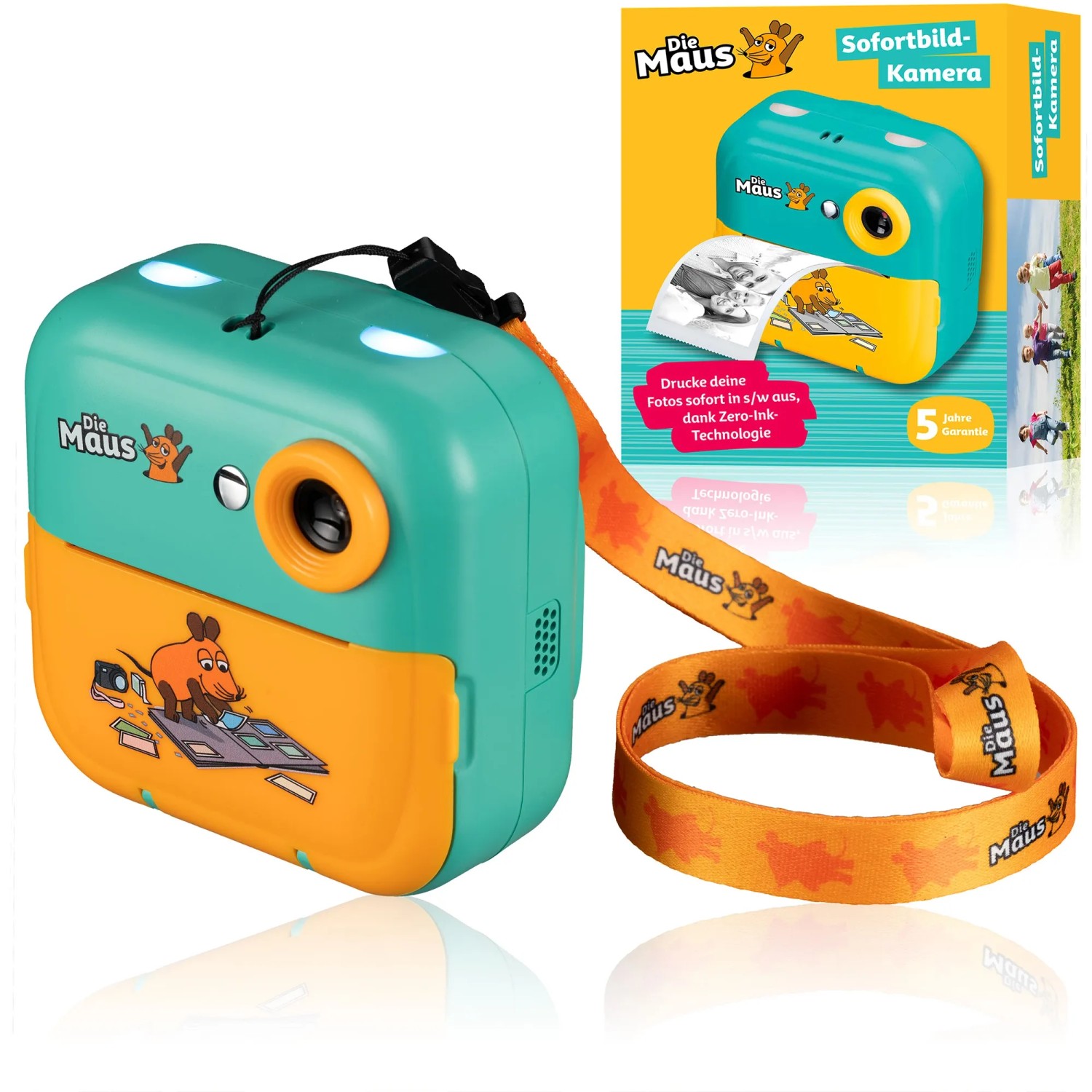 DieMaus Sofortbildkamera für Kinder, grün-orange, mit Trageriemen und Verpackung.