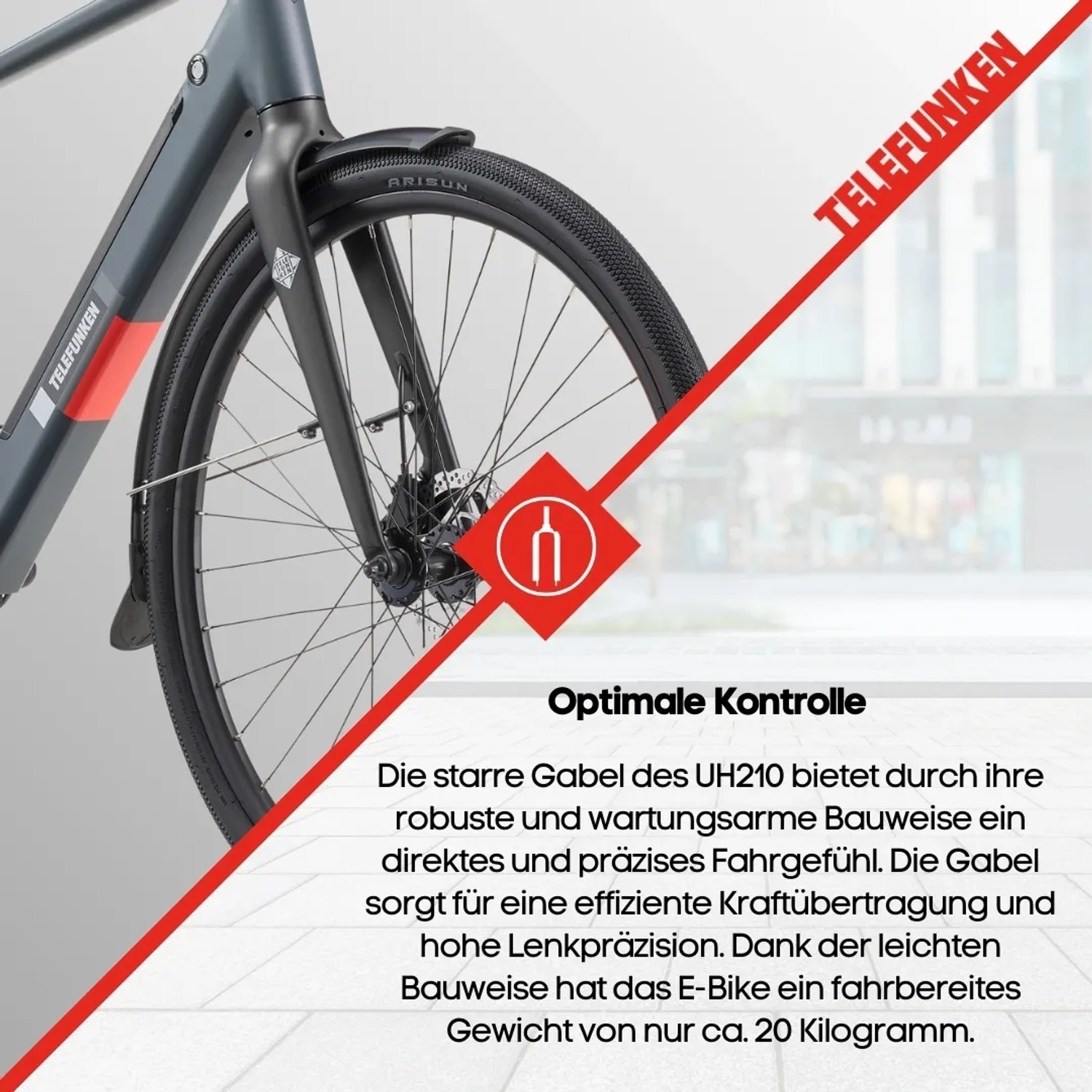Detailaufnahme Vorderrad des grauen Telefunken UH210 E-Bikes. Fokus auf Gabel und Reifen.