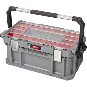 Graue Keter Connect Werkzeugbox mit Tragegriff und transparentem Deckel mit roten Fächern.
