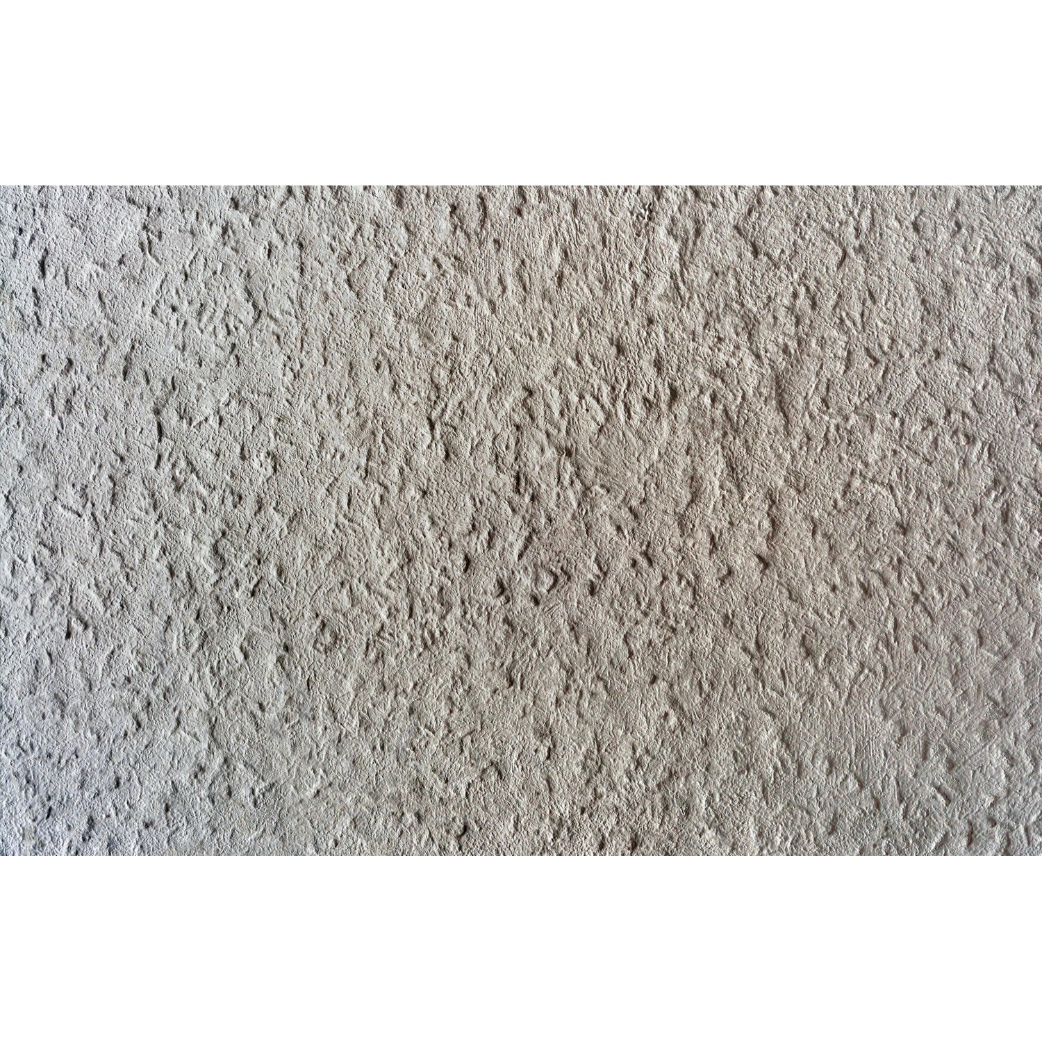 Nahaufnahme einer Wand mit aufgetragener, reliefartiger Fischer Reparaturspachtel (3er-Pack).