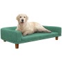 PawHut Hundesofa in Grün mit Hund liegt entspannt auf dem Hundebett mit Holzbeinen.