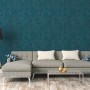 Wohnzimmer mit blauer Vliestapete Trendwall 2 Uni Glänzend von A.S. Création.