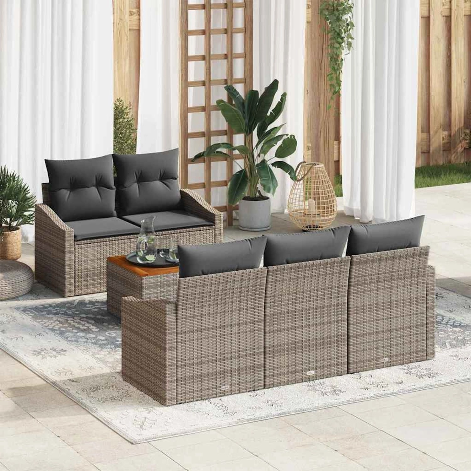 Graues 6-teiliges vidaXL Garten-Sofa-Set aus Poly Rattan mit Kissen und Tisch.
