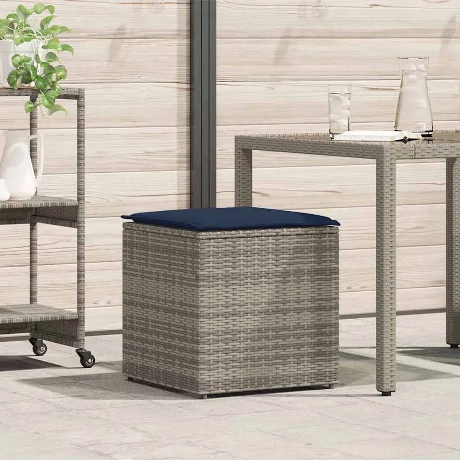 Graue vidaXL Kissenbox aus Poly-Rattan mit blauem Kissen, ideal zur Aufbewahrung im Garten.
