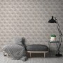 Beige-cremefarbene Vliestapete mit geometrischem 3D-Effekt und Glitzer für Wohnräume.