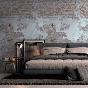 PROFHOME Fototapete Ziegelstein grau-beige-rot im Schlafzimmer mit Bett und Dekoration.