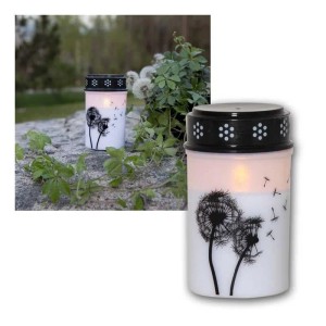 Weißes LED-Grablicht mit Pusteblumen-Motiv, schwarzem Deckel und warmweißem Flackerlicht für Außenbereiche.