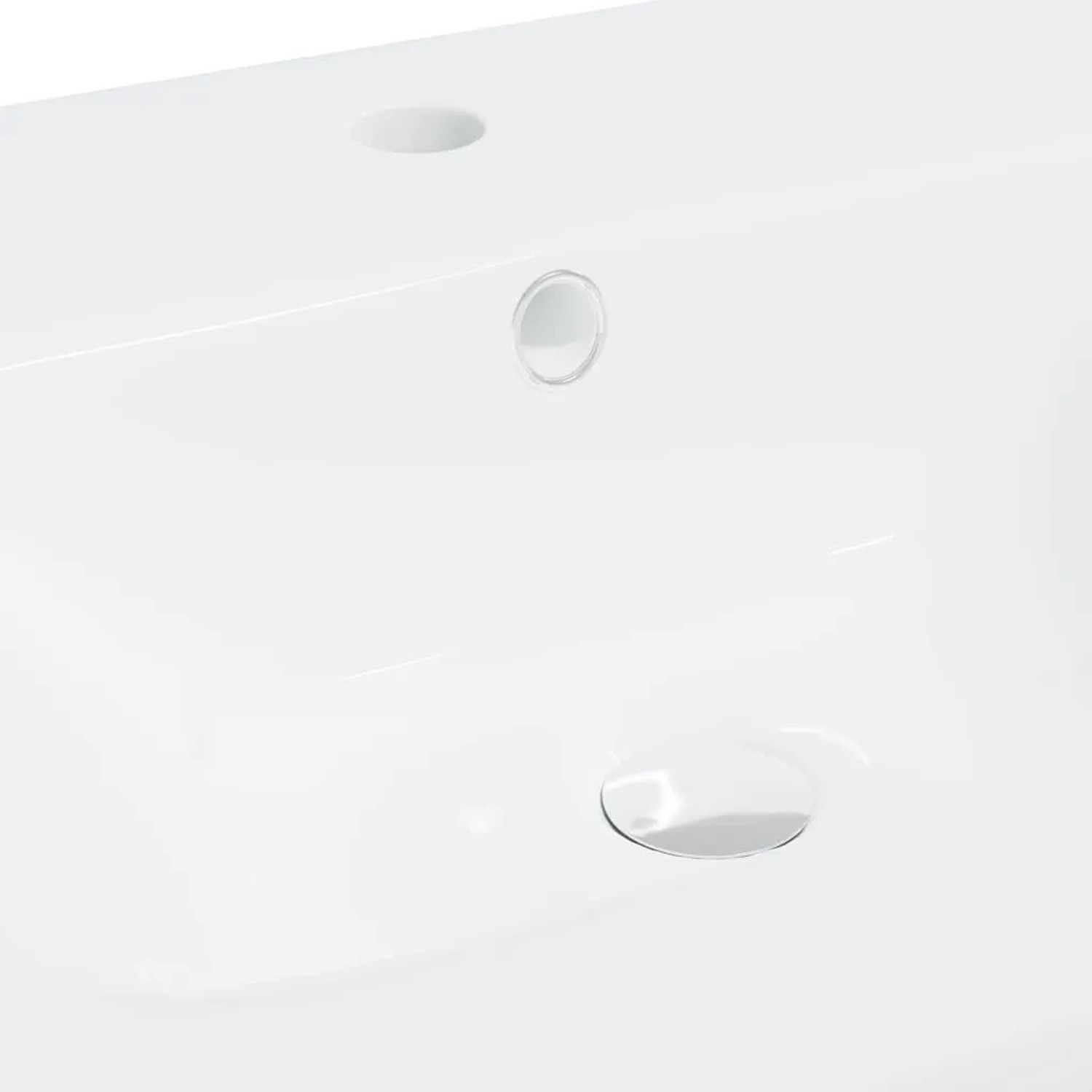 Weißes Keramik Einbauwaschbecken mit Hahnloch, Überlauf und Ablauf. Glänzende Oberfläche für Bad und WC.