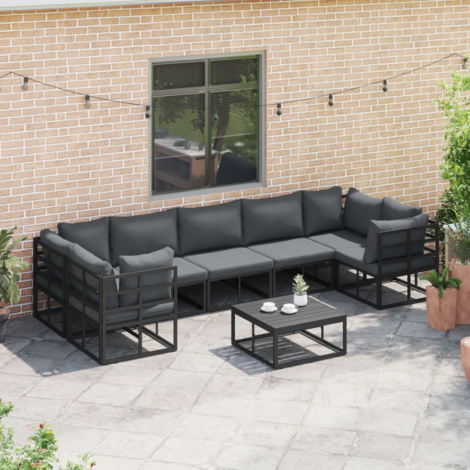 Schwarzes 7-teiliges Garten-Sofa-Set aus Aluminium von vidaXL mit Tisch und grauen Kissen.