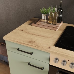 Flex-Well Küche Cara in Schilfgrün/Artisan Eiche mit Kochfeld und Arbeitsplatte.