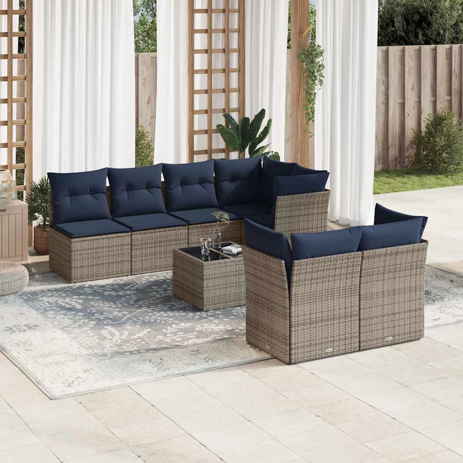 8-teilige graue vidaXL Garten-Sofagarnitur aus Polyrattan mit marineblauen Kissen.