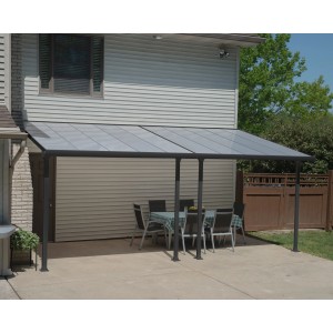 Anthrazit Terrassenüberdachung Feria 3x6.10 von Palram-Canopia mit Tisch und Stühlen.