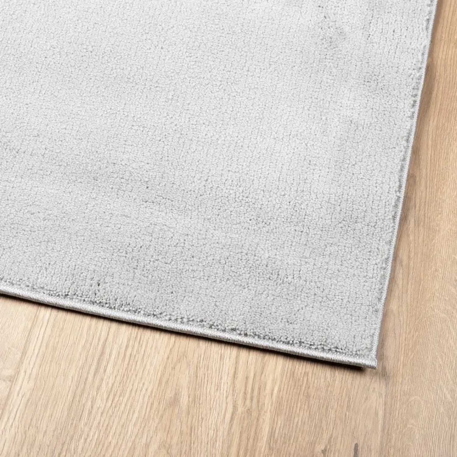 Grauer Kurzflor Teppich OVIEDO, 80x250 cm, mit weicher Polyester-Textur.