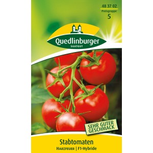 Samenpackung Quedlinburger Stab-Tomate 'Harzfeuer' mit reifen, roten Tomaten am Strauch.