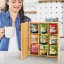 Relaxdays Teebox aus Bambus mit 9 Fächern zur Wandmontage, gefüllt mit Teebeuteln.